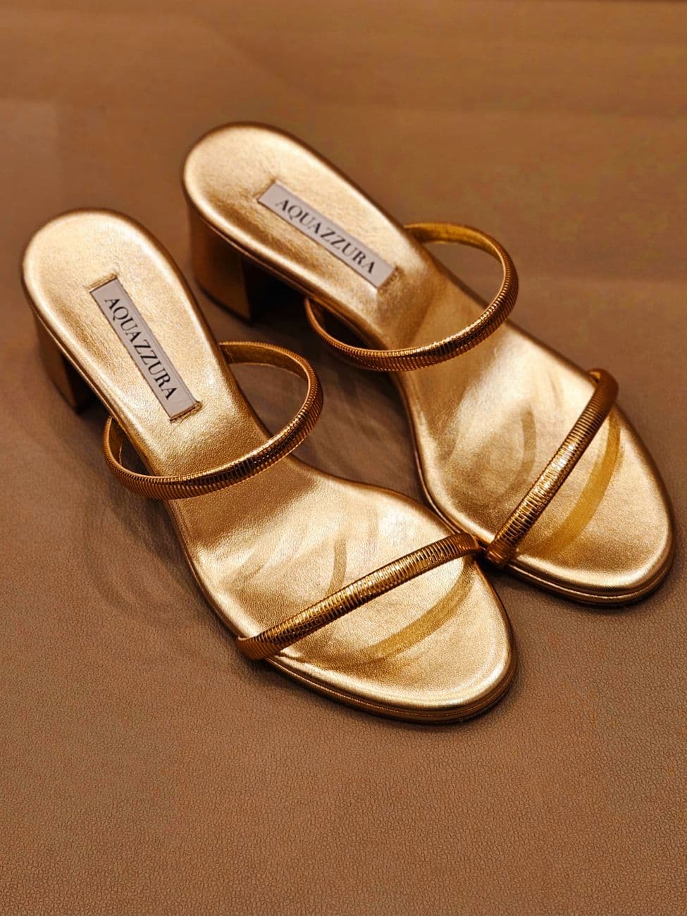 Metallic gold Aquazzura heeled sandals